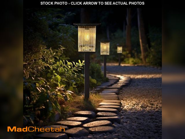 Lot 74-12854614 - Monteaux Lighting Black Integrated LED Outdoor Solar Pathway Lights with Clear Ribbed Glass (4-Pack)...