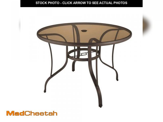 Lot 74-12360595 - 42 in. Mix and Match Steel Round Outdoor Patio Dining Table with Bronze Smoky Glass - UNUSED