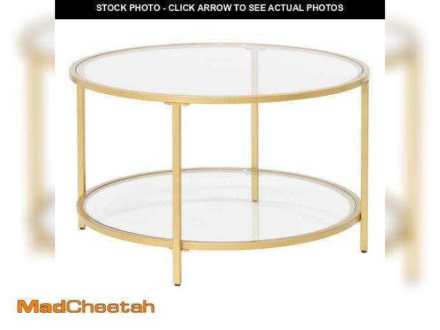 Lot 74-12681061 - Studio Designs Home Camber Elite 28 in. Gold Round Glass Coffee Table - UNUSED