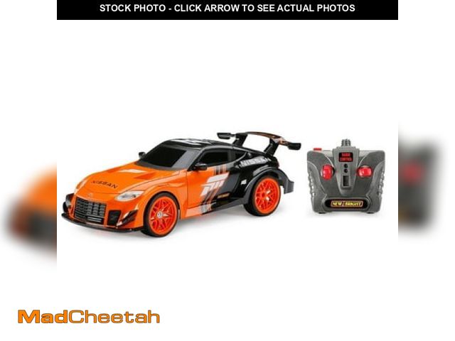 Lot 74-12422094 - New Bright (1:16) Forza Nissan Z Battery Remote Control Sports Car  Orange 942U-5 Child - UNUSED