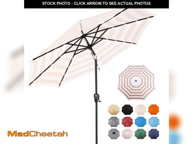 Lot 74-14115523 - Sun-Ray 9 ft. Steel Market Solar Lighted 8-Rib Round Patio Umbrella in Beige and White Stripe - UNUS...