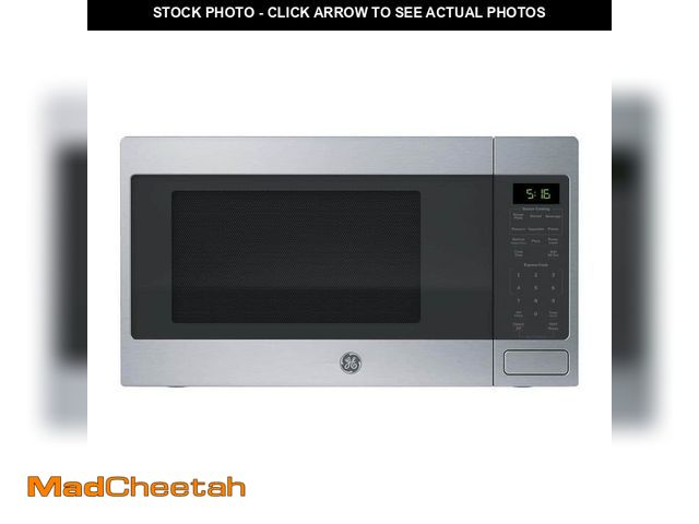 Lot 74-12685614 - (DENTED) GE 1.6 Cu. Ft. Countertop Microwave Oven - UNUSED