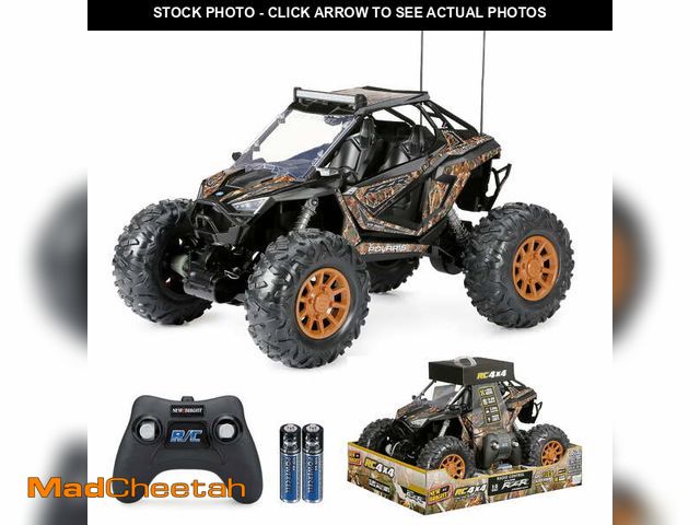 Lot 74-12685474 - (MISSING BATTERIES,FLAG) New Bright (1:5) Polaris RZR XP Pro 12.8V Battery Remote Control Camo ATV 2...