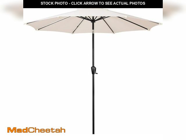 Lot 74-12663765 - 9 ft. Round 8-Rib Steel Market Patio Umbrella in Creamy Beige - USED