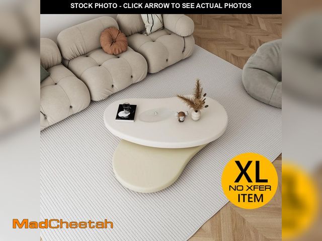 Lot 74-12584039 - 47.24 in. Beige Oval Shape 2-Tier Rotating MDF Top Coffee Table - UNUSED