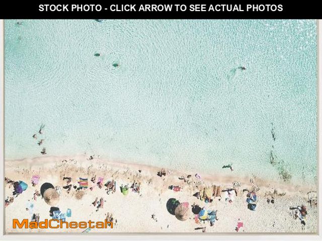 Lot 74-12141294 - DesignOvation Sylvie Turquoise Beach from Above Framed Canvas Wall Art by Amy Peterson, 23x33 White,...