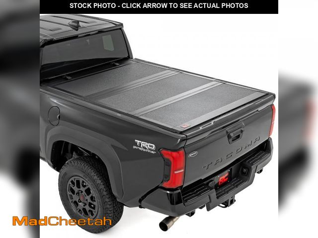 Lot 74-12278712 - Rough Country Hard Tri-Fold Truck Bed Tonneau Cover for Toyota Tacoma (2024-2025) - Aluminum Flip-Up...