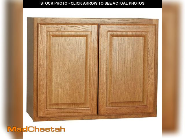 Lot 74-13286994 - Hampton Bay Hampton 30 in. W x 12 in. D x 24 in. H Assembled Wall Bridge Cabinet in Medium Oak - UNU...