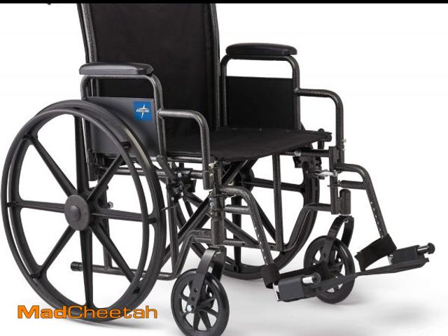 Lot 74-12096335 - Medline Comfortable Folding Wheelchair with Swing-Back Desk-Length Arms and Swing-Away Footrests, 20...