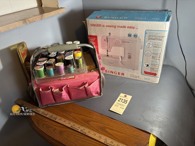 Lot 83-2135 - Singer Start 1304 Sewing Machine and Tote of Sewing Supplies