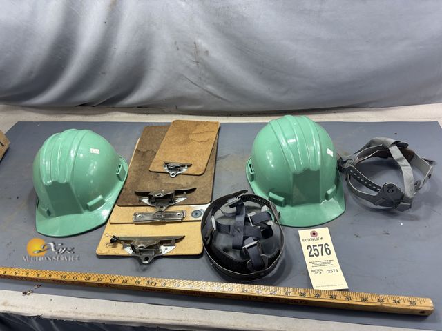 Lot 83-2576 - Two Hard Hats and Clip Boards