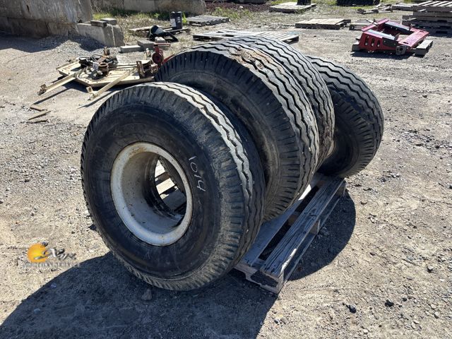 Lot 83-1014 - Four Semi and Trailer Tires and Rims 10-15 Size