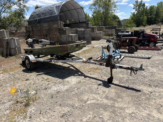 Lot 83-1021 - EZ Loader Boat Trailer with Small Jon Boat