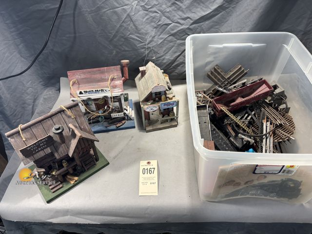 Lot 83-0167 - Three Decorative Houses and a Tote of Miscellaneous Train Tracks