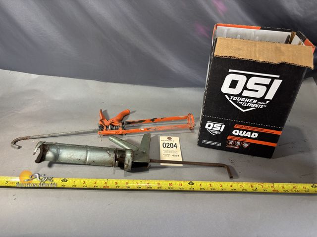 Lot 83-0204 - Two Caulk Guns and a Box of OSI Quad Sealant