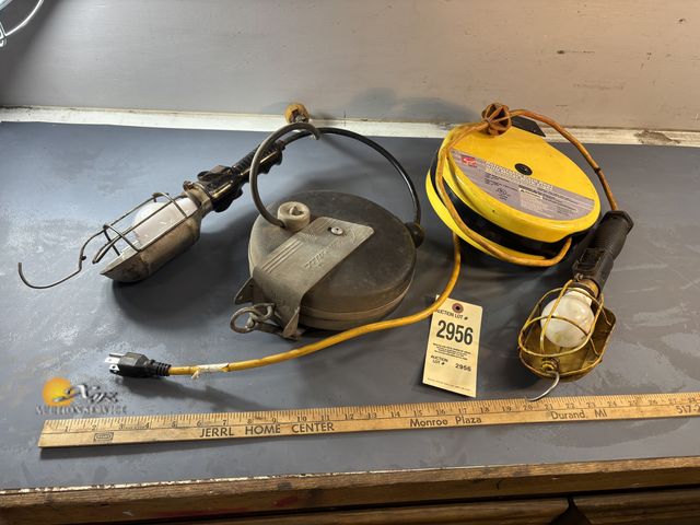 Lot 83-2956 - Two Retractable Light Extension Cords