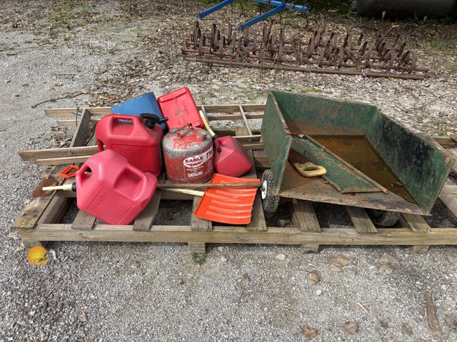 Lot 83-1036 - Lot of Gas Cans, a yard cart, a wooden ladder, and Hand Tools