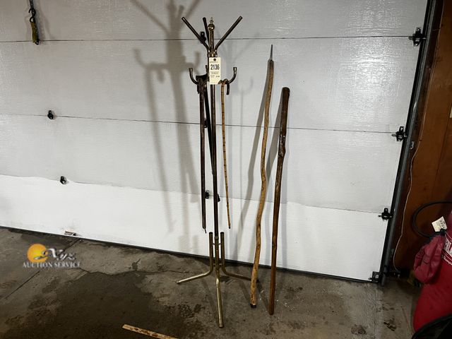Lot 83-2136 - Coat Rack and Four Walking Sticks