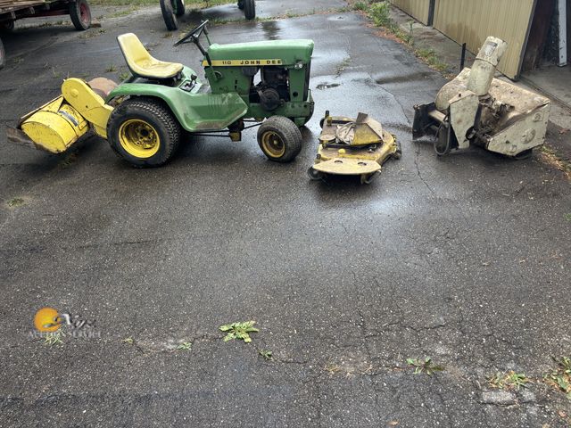 Lot 83-1012 - John Deere 110 Riding Lawn Mower With Mower Deck, Tiller, and Snowblower