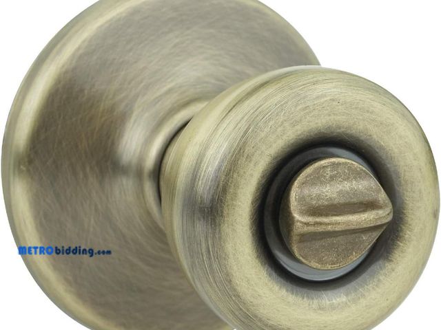 Lot 88-493690 - Kwikset 300T 5 CP RCL RCS BBPKG Tylo Bed/Bath Knob in Antique Brass