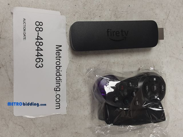Lot 88-484463 - Fire TV stick and steering wheel remote control