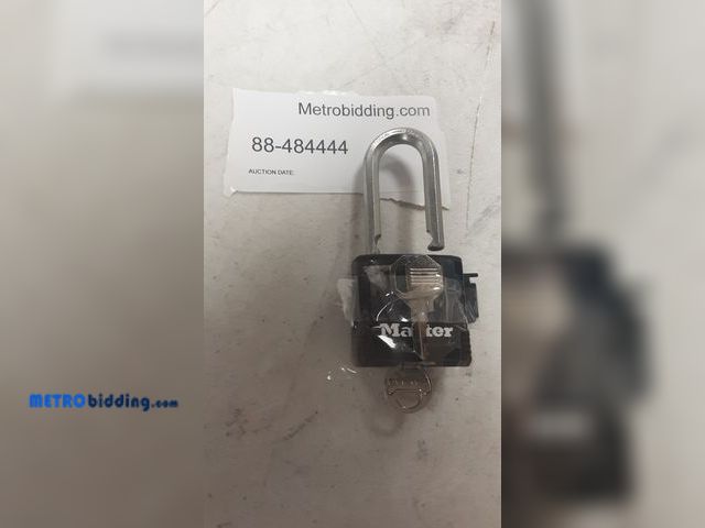 Lot 88-484444 - Master Lock Magnum heavy-duty padlock featuring a black weather-resistant cover over a laminated ste...