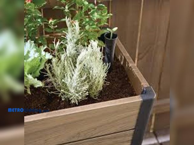 Lot 88-501350 - Vigoro Oak Vinyl Resin Garden Bed Planter with Storage Shelf (44 in. L x 18 in. W x 31 in. H)