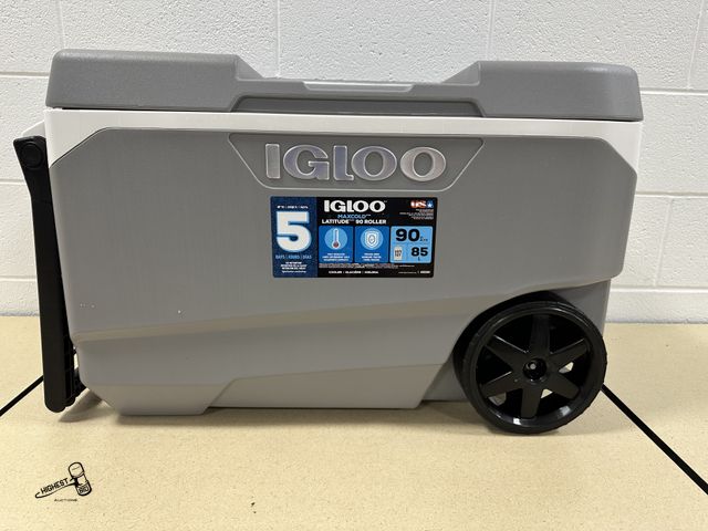 Lot 91-7187 - 1 90 QT IGLOO MAXCOLD LATTITUDE COOLER - ON WHEELS - HAS DRAIN - MISSING SMALL COMPARTMENT DOOR - ST...