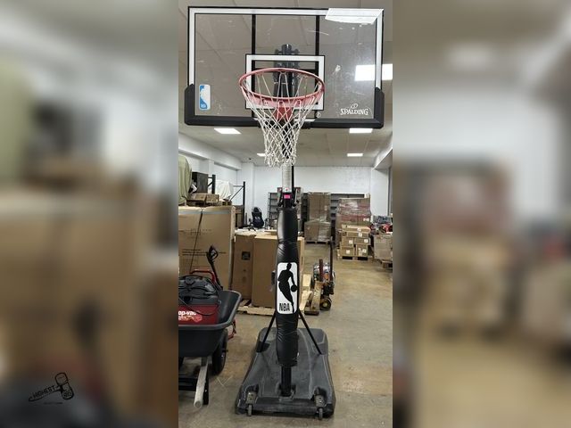 Lot 91-6558 - SPALDING 54" PORTABLE HOOP SYSTEM - PRO GLIDE ADVANCE LIFT SYSTEM - PRO SLAM BREAKAWAY RIM - BLOW MO...