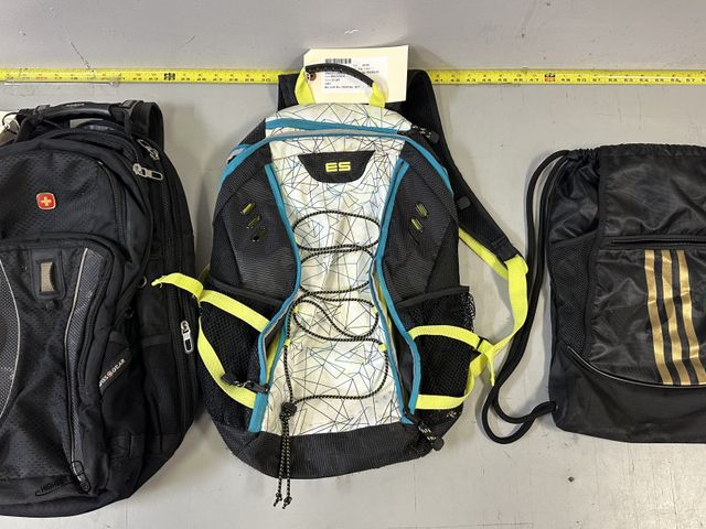 Lot 91-9716 - 1 BLACK ADIDAS DRAWSTRING BAG, 1 ES BLACK AND COLORFUL BACKPACK, 1 SWISS GEAR BLACK BACKPACK