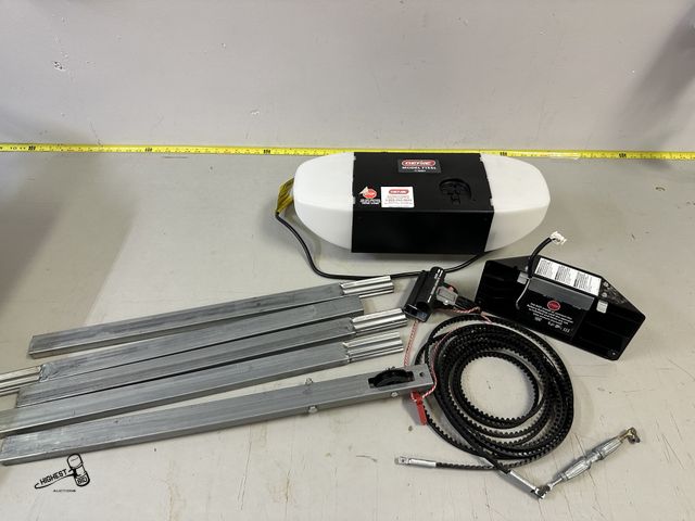 Lot 91-7071 - GENIE GARAGE DOOR OPENER MODEL 7155L - COMES WITH 9'3" TRAVEL BAR, THE BELT TO TRAVEL, AND THE BACKU...