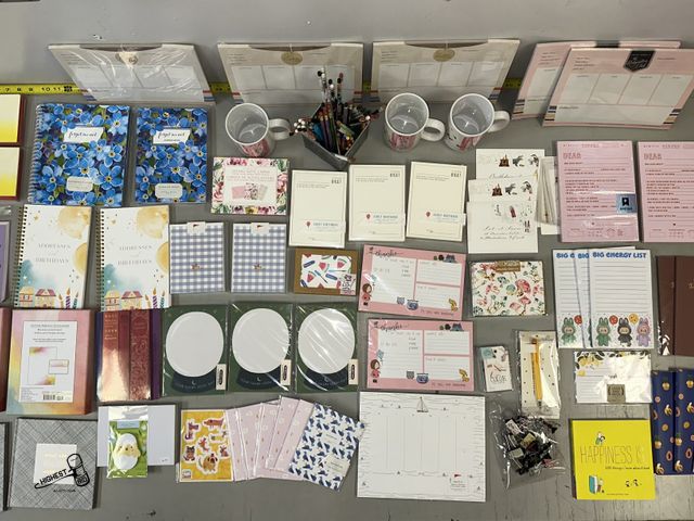 Lot 91-8374 - New TABLE FULL OF STATIONARY PRODUCTS - DOG SITTER CALENDARS - MUGS - PENCILS - NOTEPADS &amp; MUCH ...