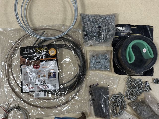 Lot 91-10084 - MISCELLANEOUS LOT WITH AUTOMOTIVE BRAKE LINE, VINTAGE PONTIAC STEERING WHEEL HORN, KHOLER AIR FILTER...