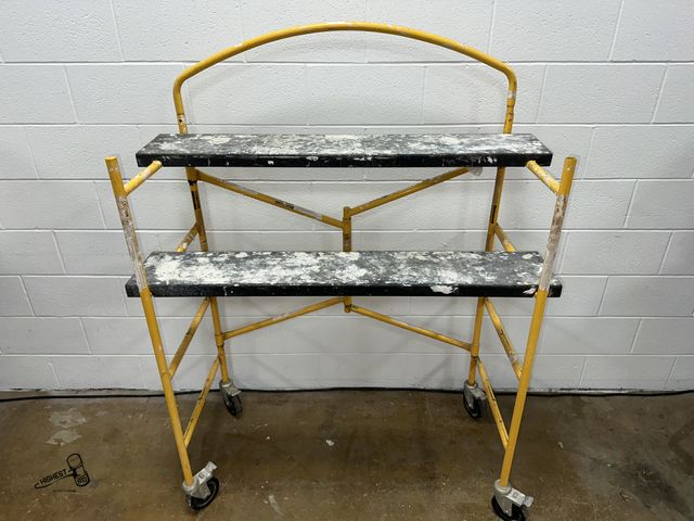 Lot 91-8763 - PORTABLE SCAFFLE UNIT ON WHEELS WITH LOCKS 2 PLATEFORMS 48" X 8.5" - BREAKS DOWN &amp; FOLDS UP WITH...