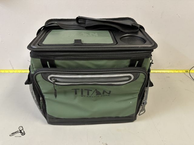 Lot 91-7364 - TITAN BY ARTIC ZONE TRAVEL COOLER WITH STRAP AND EXTRA STORAGE COMPARTMENTS