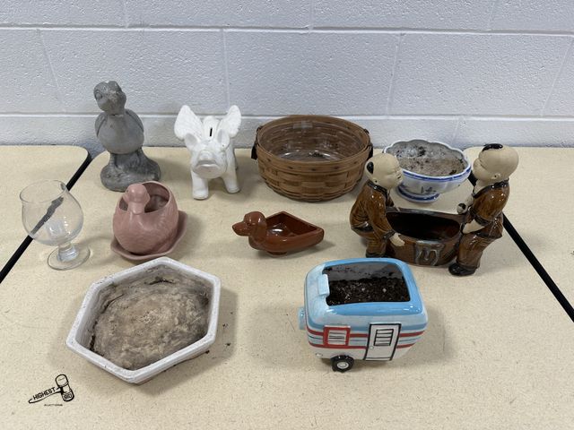 Lot 91-10329 - TABLE FULL OF CERAMIC PLANTERS, WINE GLASS, CERAMIC FLYING PIG PIGGY BANK, VINTAGE 1988 DUCK CEMENT ...