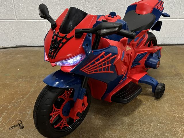 Lot 91-9778 - MSRP $118.00 LIKE NEW WITH BOX AND CHARGER  6V Spiderman Motorcycle, Battery Ride on Toy, for Kids, ...