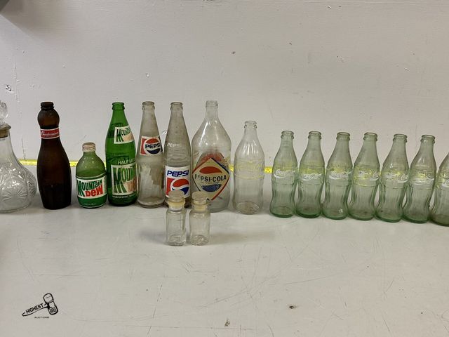 Lot 91-8829 - VINTAGE BOTTLE COLLECTION - BUDWEISER - MOUNTAIN DEW - PEPSI - COCA COLA &amp; MORE IN MIKLK CRATE