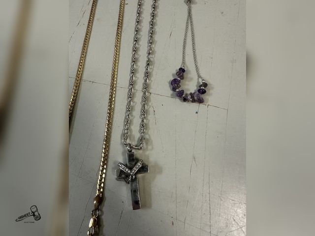 Lot 91-7817 - 3 piece jewelry 2 necklaces one with cross pendant and bracelet with purple stones