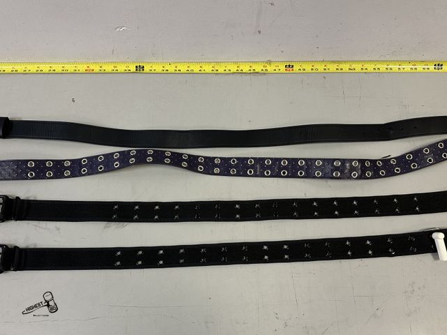 Lot 91-9686 - 4 TOTAL BELTS 2 SMALL BLACK HOT TOPIC WITH METAL HOLES DESINGS, 1 SMALL PURPLE BELT WITH METAL HOLES...