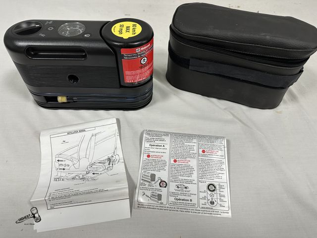 Lot 91-7578 - MOTORCRAFT AUTOMOBILE AIR COMPRESSOR WITH TEMPORARY MOBILITY KIT CANISTER TO SEAL SMALL LEAKS - 12 V...