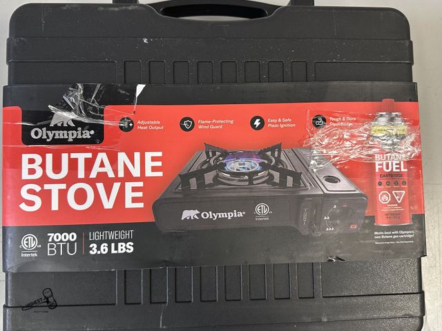 Lot 91-9414 - OLYMPIA BUTANE STOVE 7,000 BTU IN CASE - BURNER DOES APPEAR TO HAVE DAMAGE AS SEEN IN PHOTO