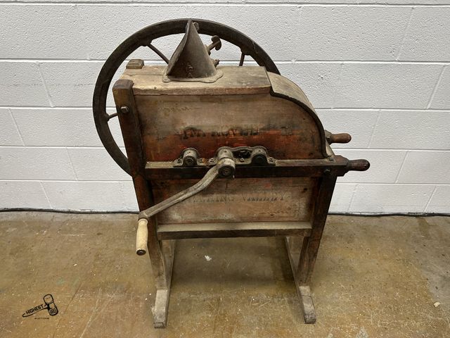 Lot 91-8775 - ANTIQUE HOCKING VALLEY HAND-CRANKED CORN SHELLER WITH CAST IRON AND WOOD CONSTRUCTION