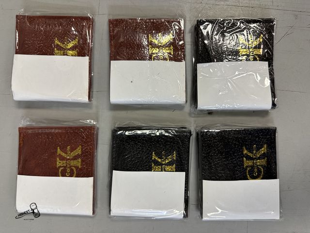 Lot 91-6386 - 6 CALVIN KLEIN WALLETS - 3 BLACK AND 3 BROWN - HAS BACK ZIPPER TO SECURE MONEY