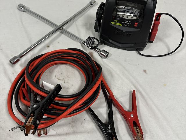Lot 91-7745 - SCHUMACHERINSTANT POWER JUMP BOX - 20 FOOT HEAVY DUTY JUMPER CABLES - 4 WAY TIRE IRON