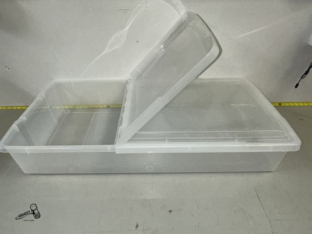 Lot 91-8689 - CLEAR PLASTIC STORAGE TOTE WITH DUAL HINGE LID 20" X 39" X 6.5"