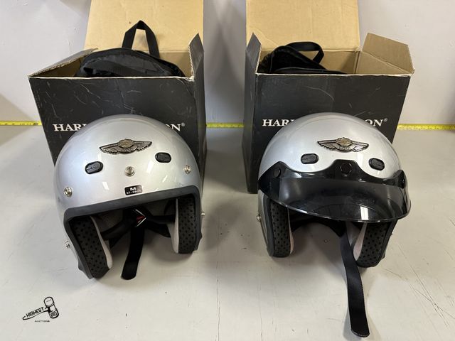 Lot 91-8227 - HARLEY-DAVIDSON 100TH ANNIVERSARY MATCHING HELMETS SILVER/BLACK 2 TONE WITH CASES AND ORIGINAL BOXES...
