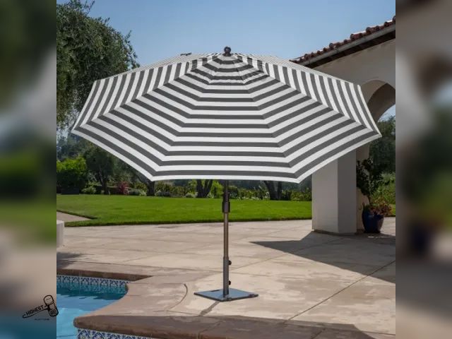 Lot 91-9490 - SunVilla 11' Round Cabana Stripe Aluminum Market Umbrella BLACK &amp; WHITE POLE IS BENT A LITTLE - ...