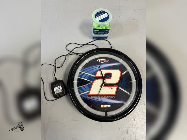 Lot 91-7093 - PENSKE RACING NASCAR KURT BUSCH WALL CLOCK WITH UNOPENED PACKAGE OF FOAM EAR PLUGS