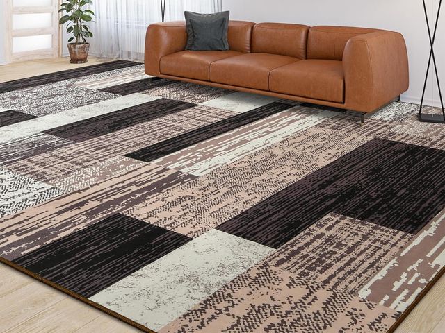 Lot 96-165804 - Large area rug. Pattern varies from stock photo. Dimensions unknown. Used, there is a slight odor bu...
